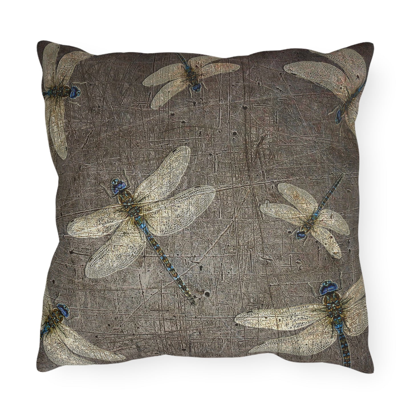 Decorative pillow with dragonfly pattern on a textured brown background