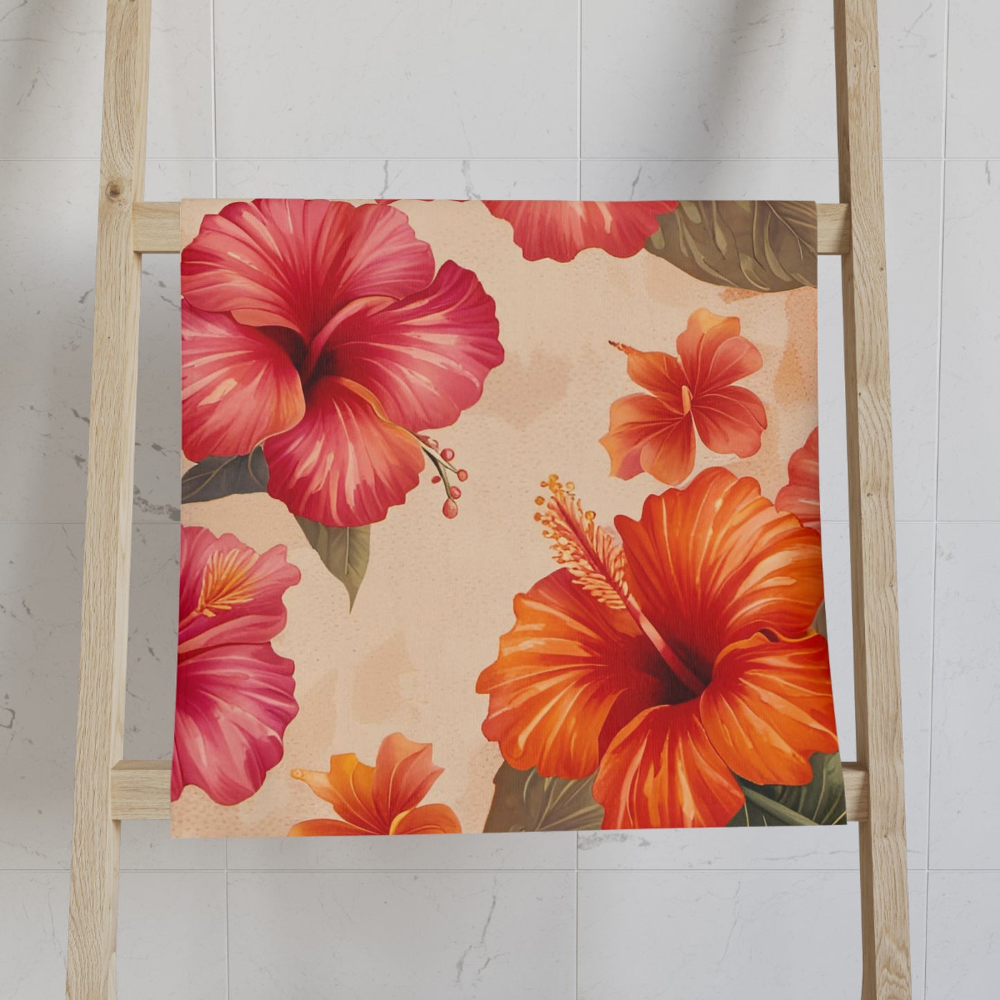 Towel with red and orange floral pattern on a wooden ladder against a white wall.