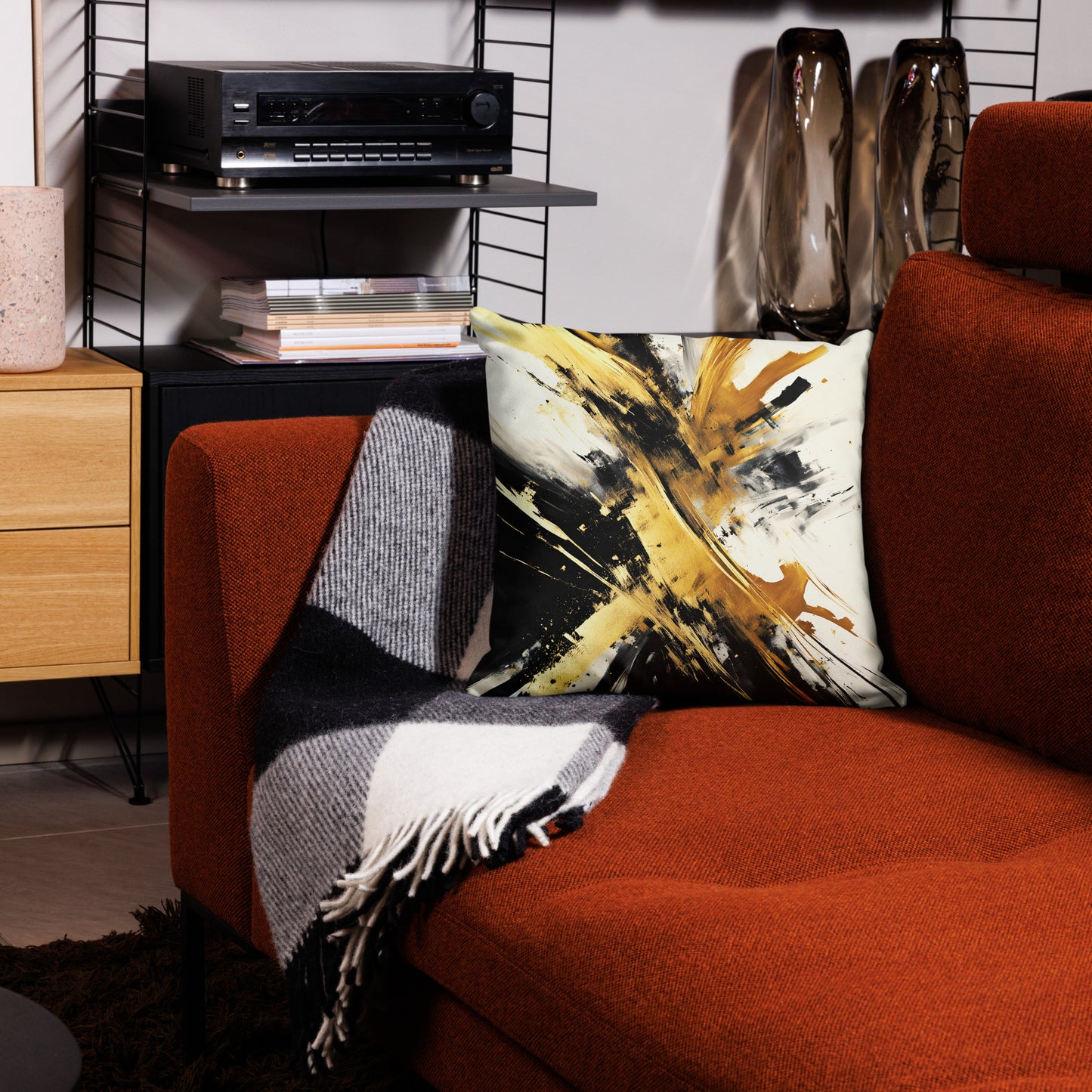 Splashing Gold Print Throw Pillow back view on red sofa