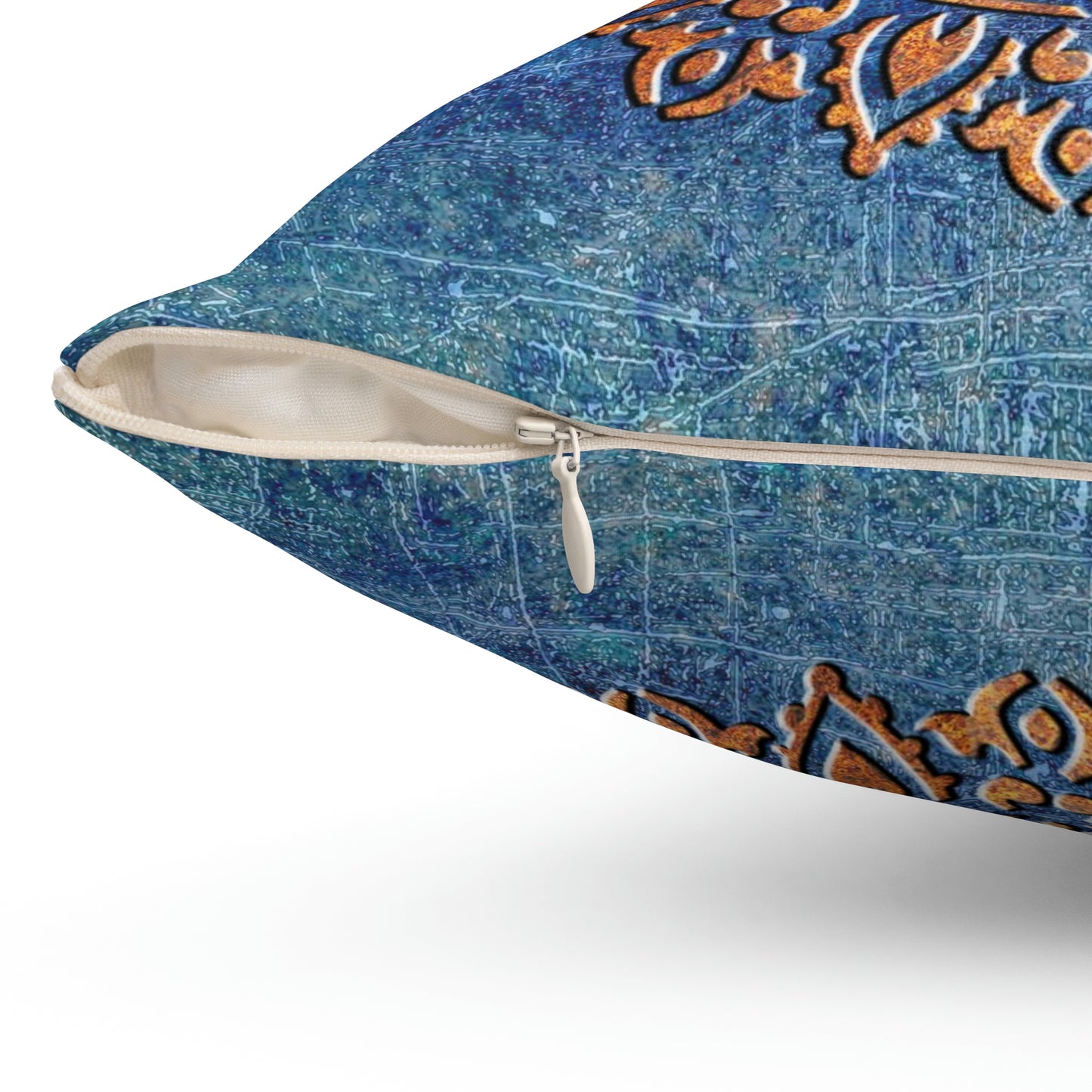 Copper Color Ohm Symbol Mandala Style Print on Distressed Blue Background Square Pillow close up zipper