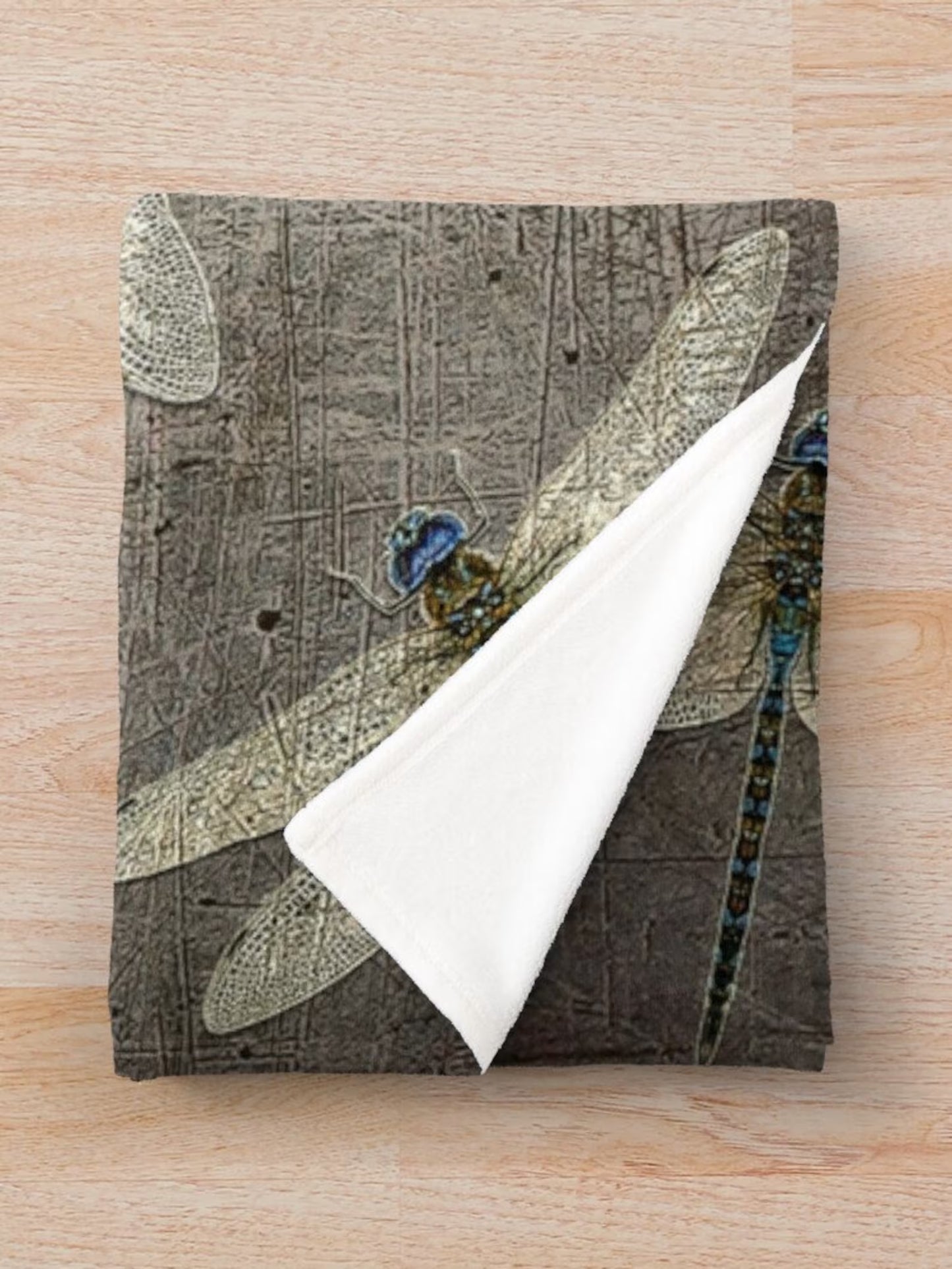Dragonfly themed blankets, flight of dragonflies on distressed stone gray background printed on minky blanket folded