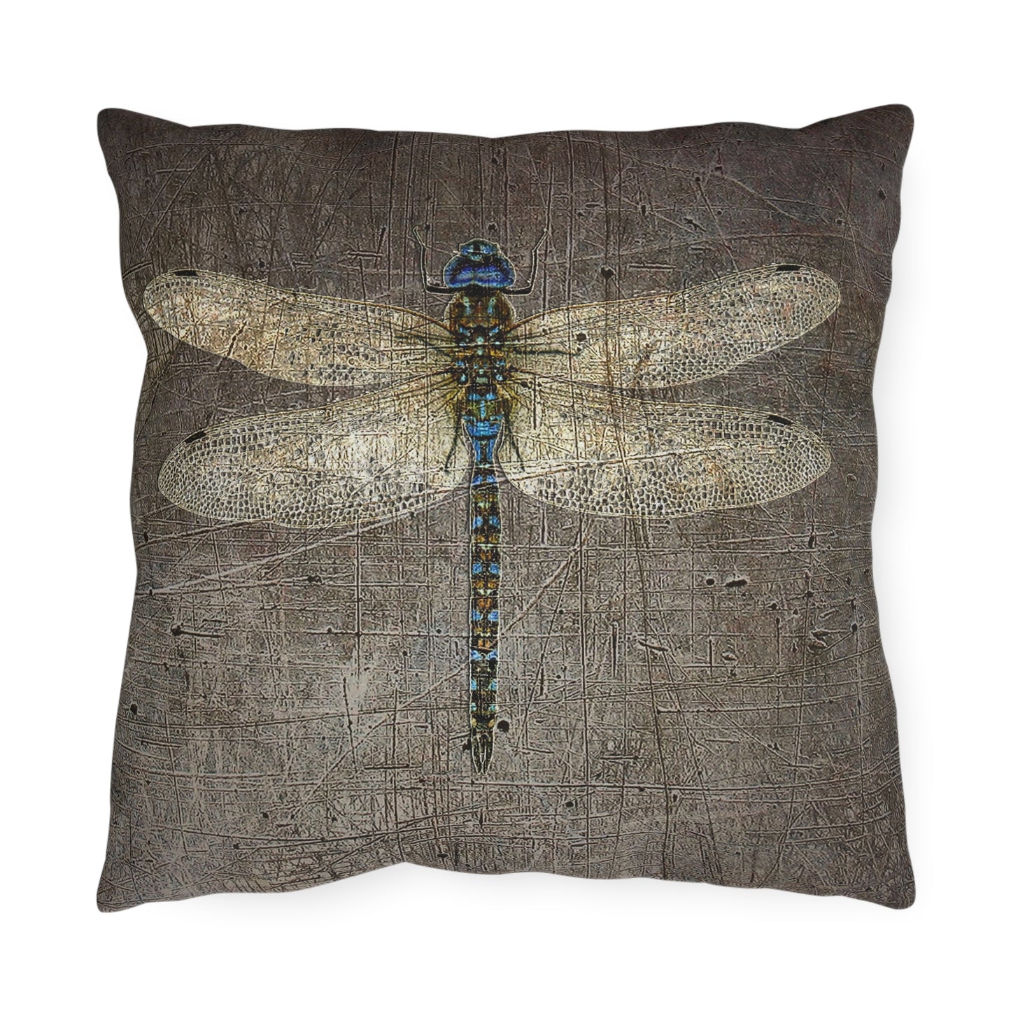 Decorative pillow with a dragonfly design on a textured brown background