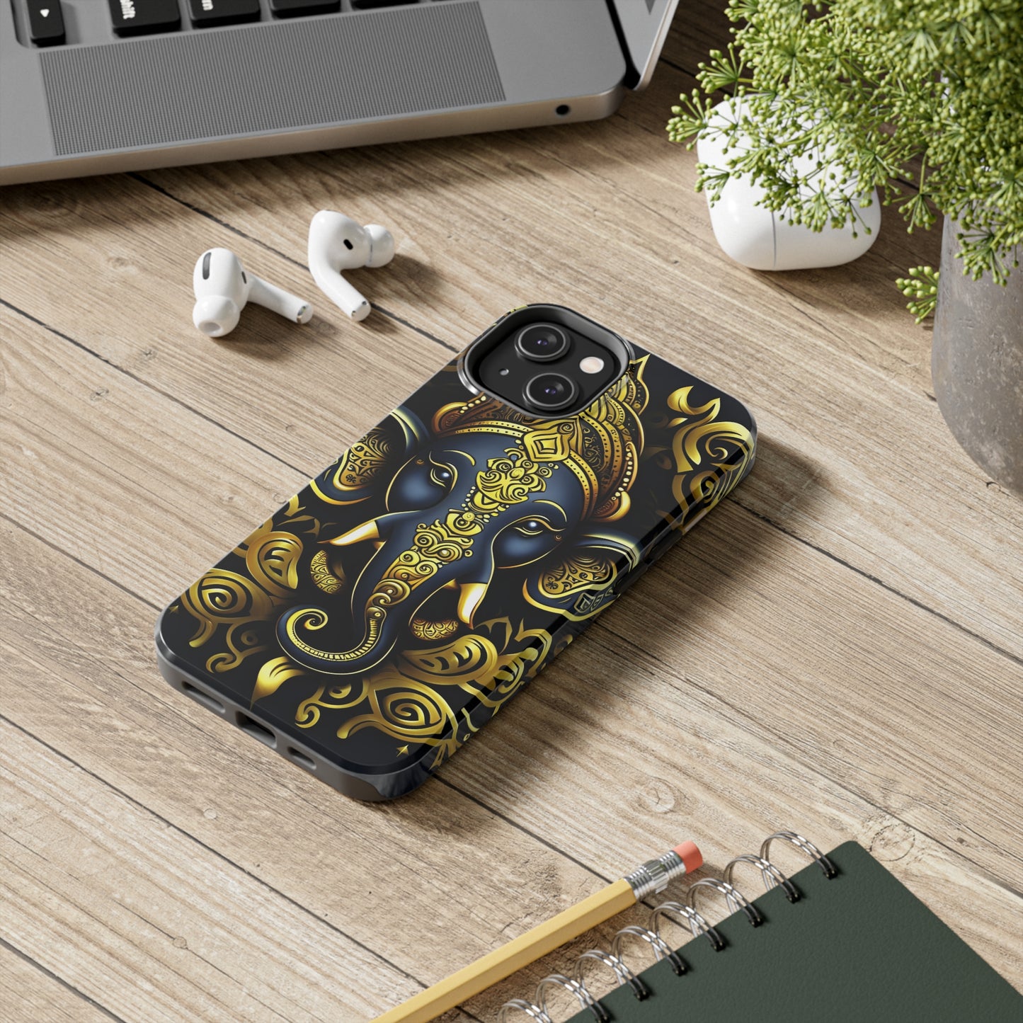 Tough Phone Case for iPhone 14  - Blue and Gold Ganesha Head Tribal Style Printed on Phone Case for iPhone 14 on desk