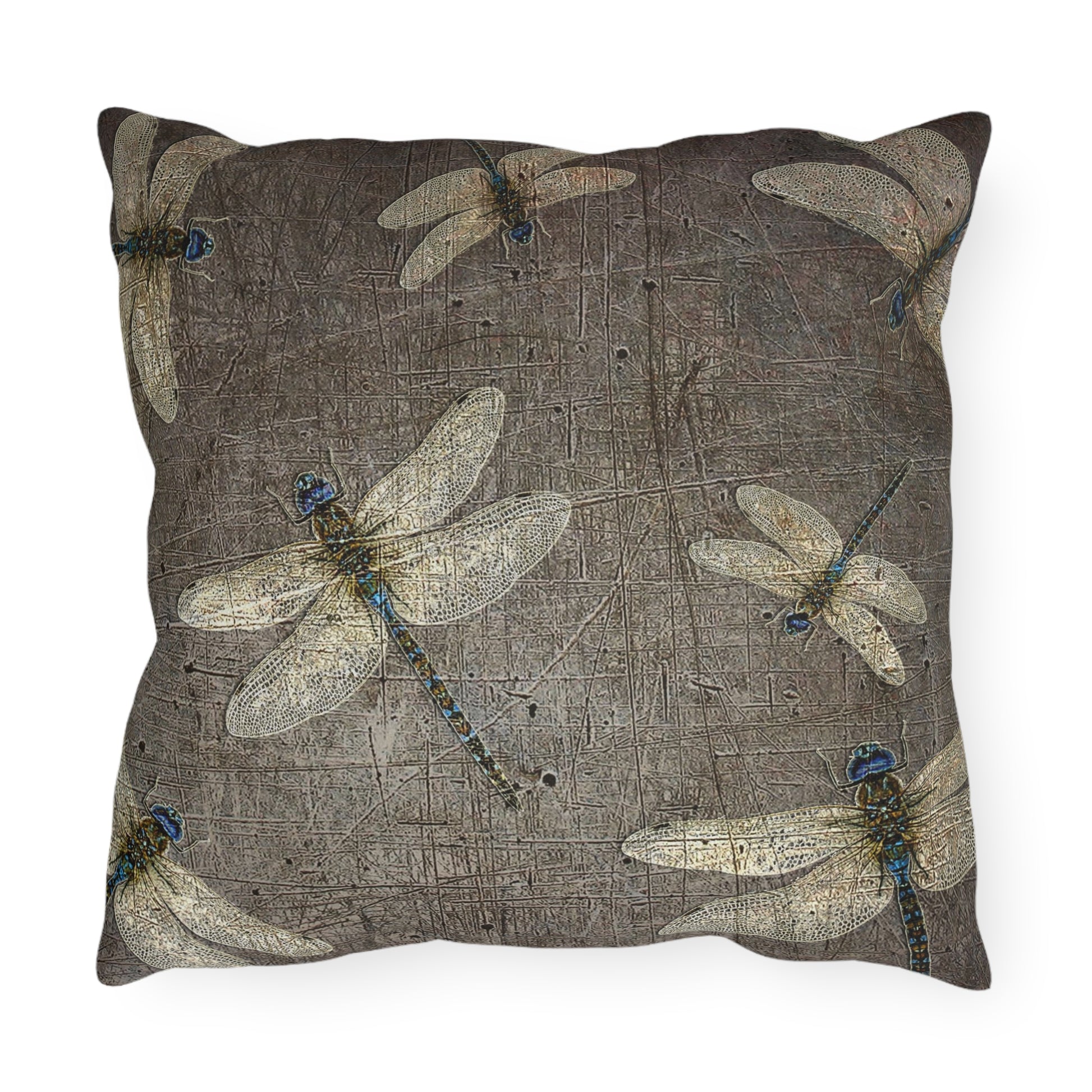 Decorative pillow with dragonfly pattern on a textured brown background