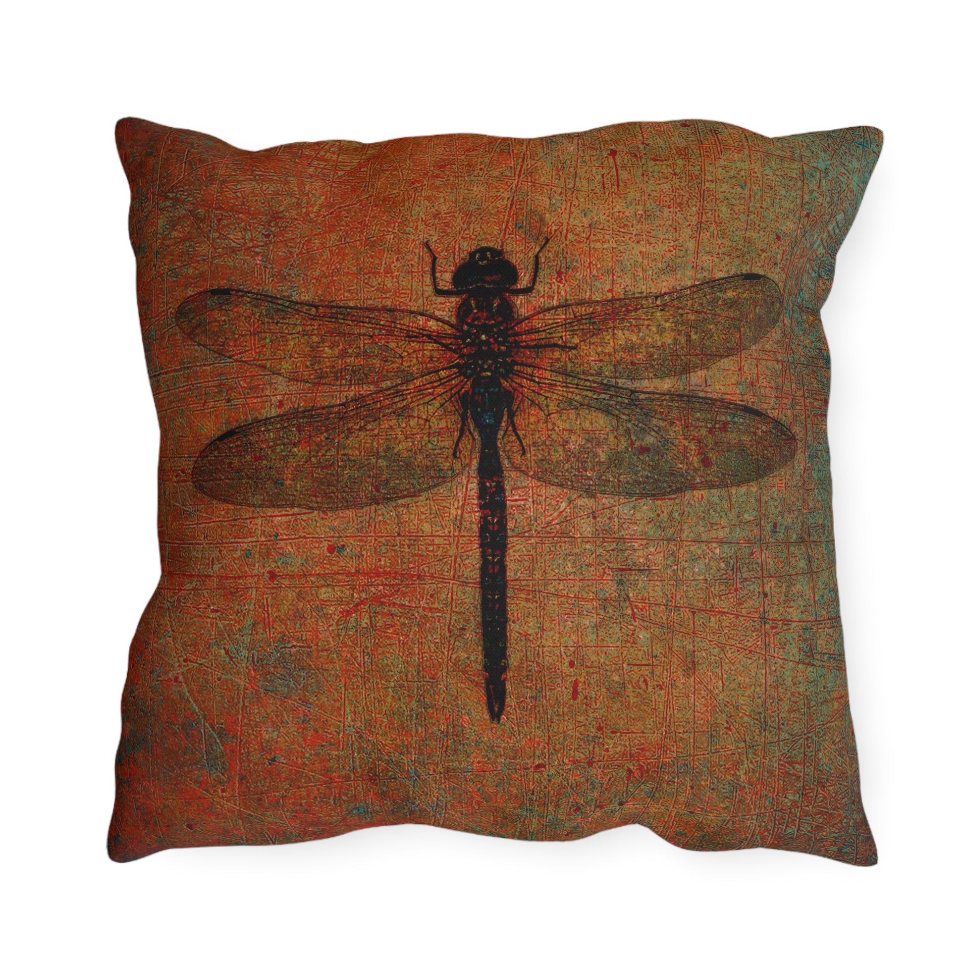Pillow with a dragonfly design on a textured fabric background