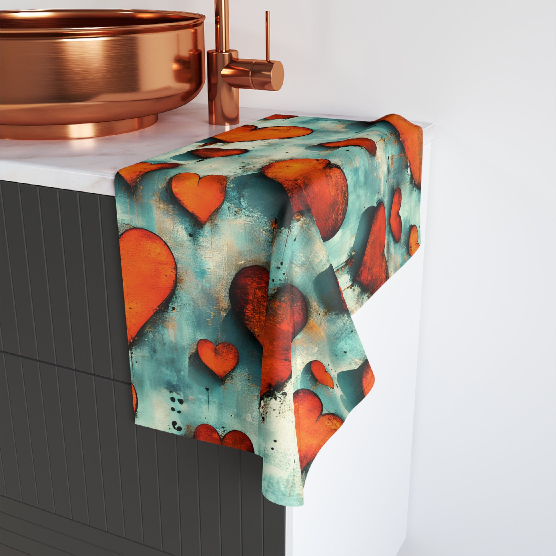 Towel with heart pattern hanging on a towel rack in a bathroom setting