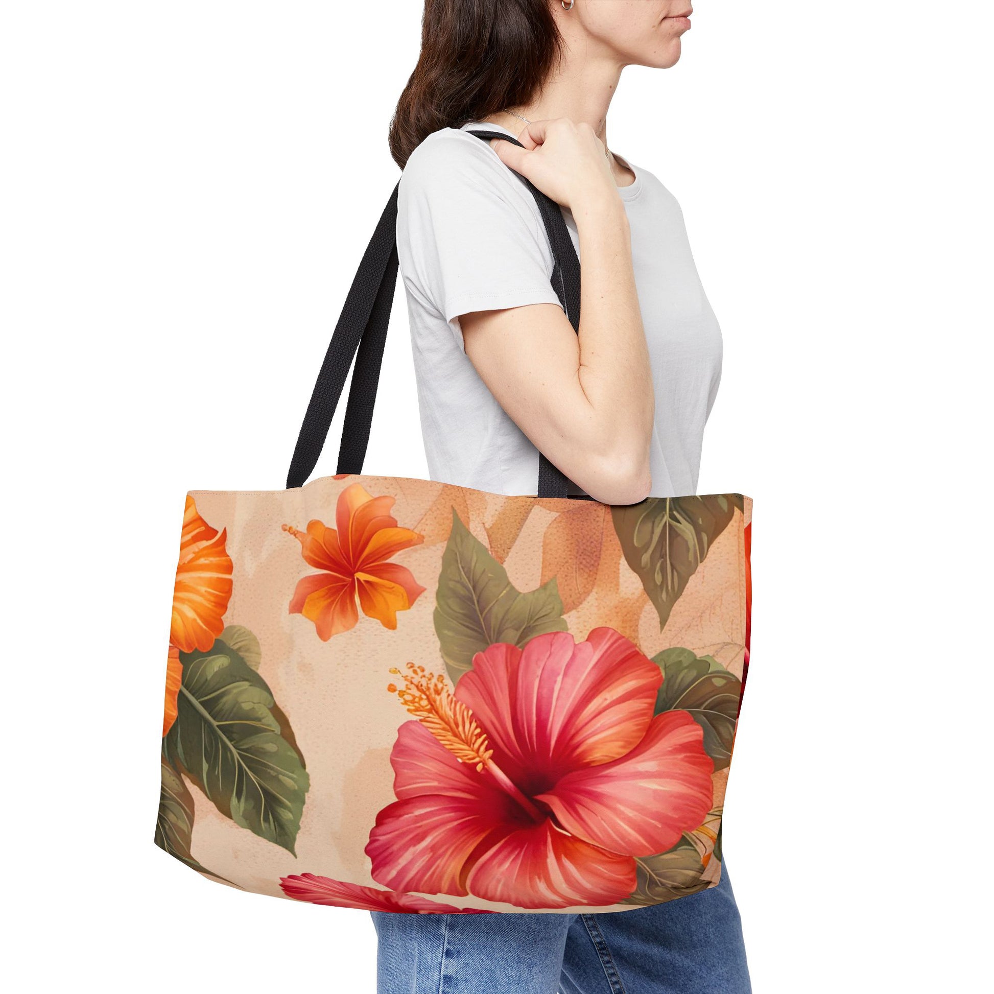 Woman carrying a tote bag with pink and orange hibiscus flower