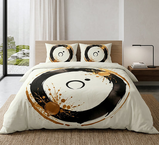 A bedding set displayed on a bed in a modern, minimalist bedroom. The set includes a duvet cover and two matching pillowcases, all featuring a large, stylized Yin Yang design in black and white with gold paint splatters.