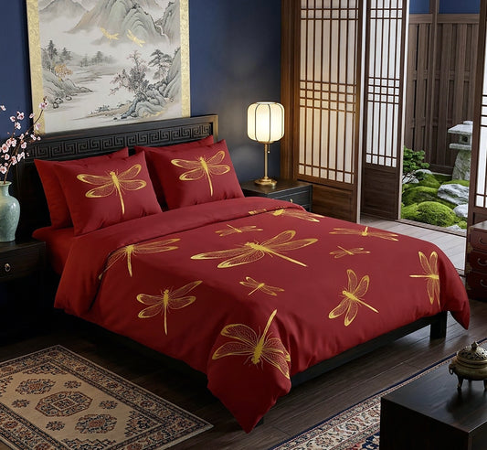 A bed dressed in a deep red bedding set with large gold dragonfly motifs, styled in a dark, elegant bedroom with wooden screens, a lamp, and a traditional painting on the wall.
