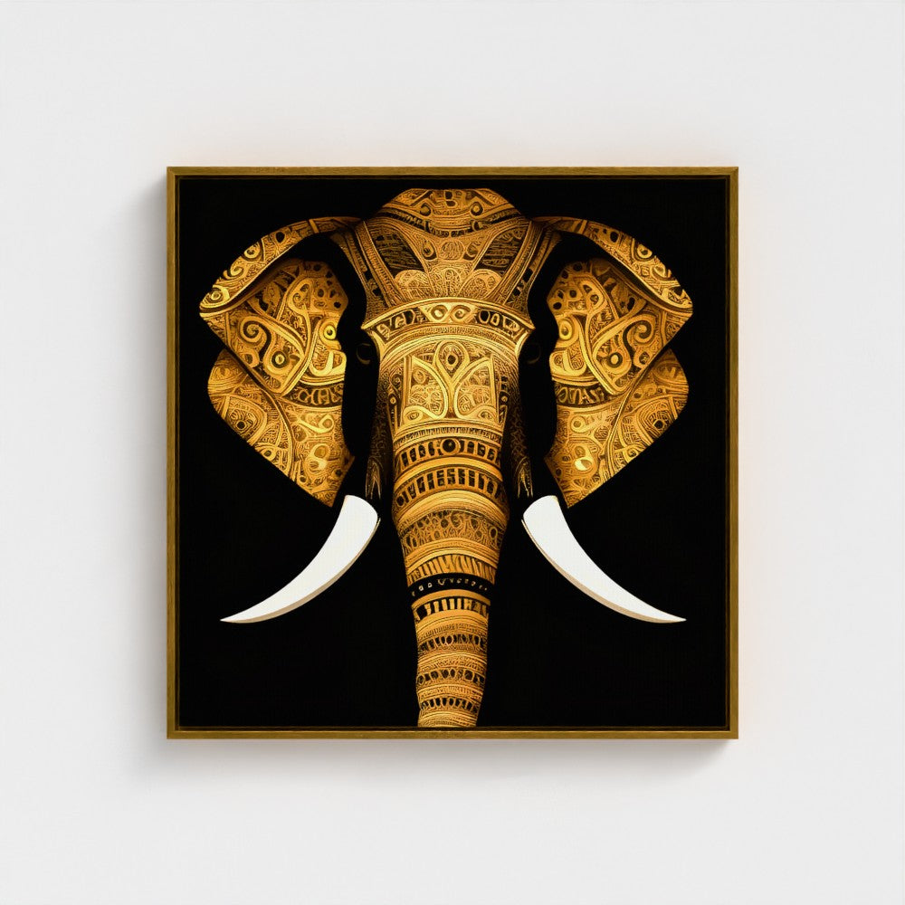 Square framed wall art featuring a stylized golden elephant head with intricate patterns and white tusks on a black background, shown hanging against a light gray wall.