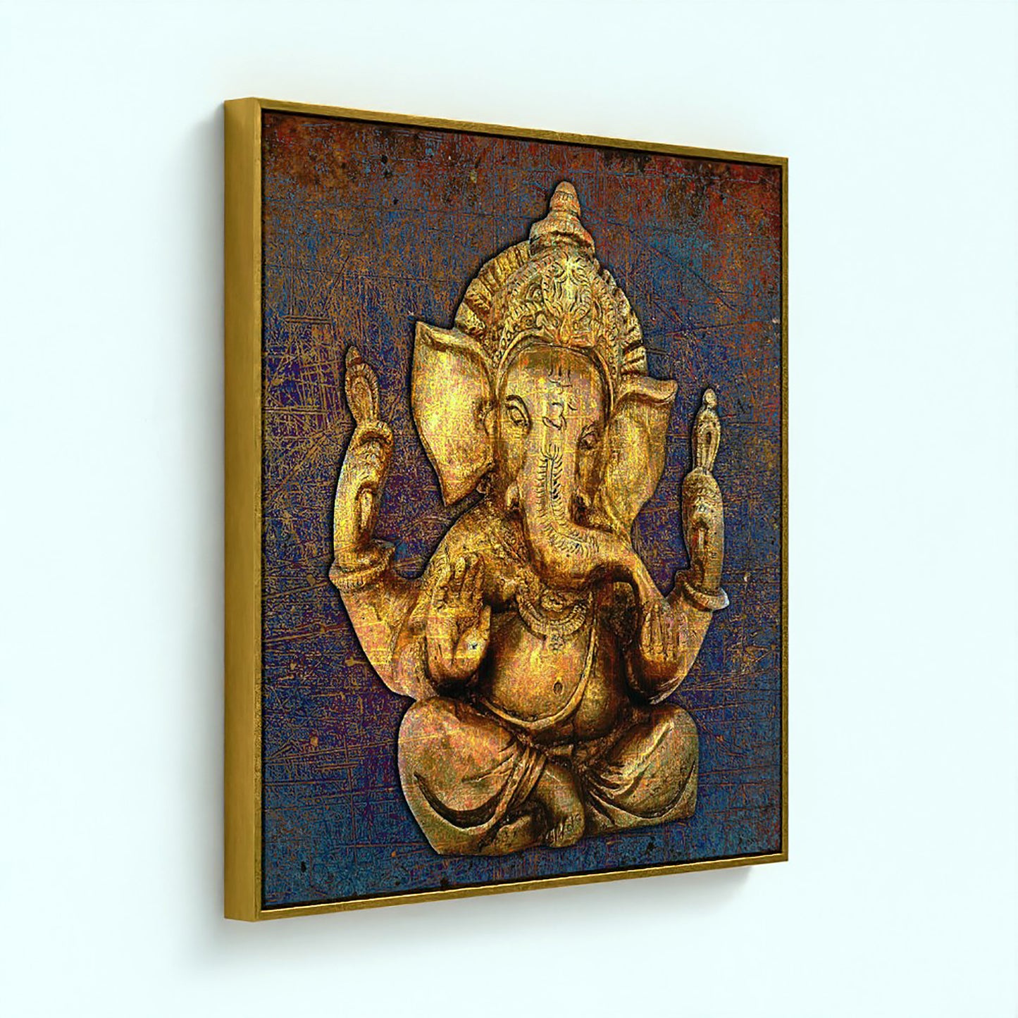 A square framed wall art print featuring a golden Ganesha statue against a textured dark blue and brown background, shown hanging on a light wall.