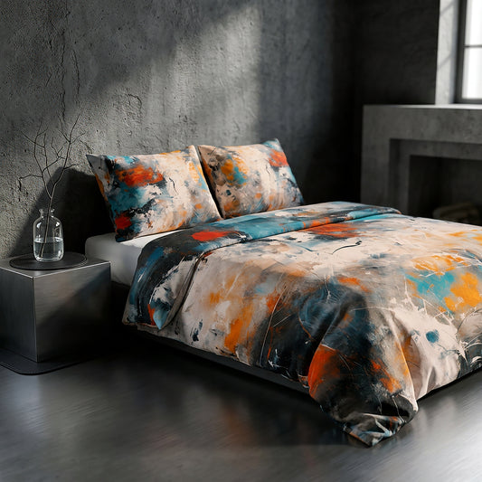 A bed dressed in an abstract painterly duvet cover and matching pillow shams, styled in a dark, modern industrial room with a concrete wall, dark wood floor, and a small side table.
