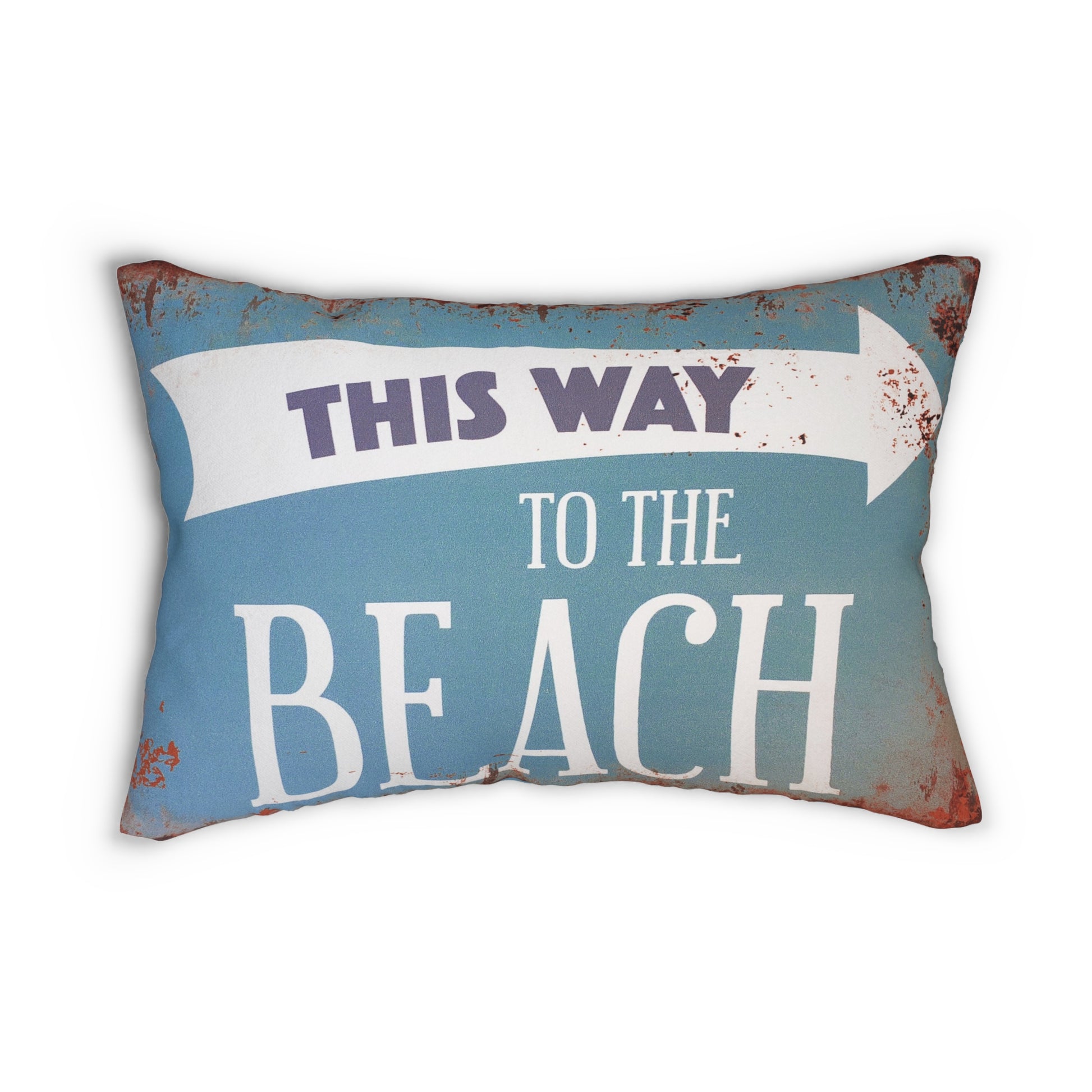 Decorative pillow with 'This Way to the Beach' text on a blue background