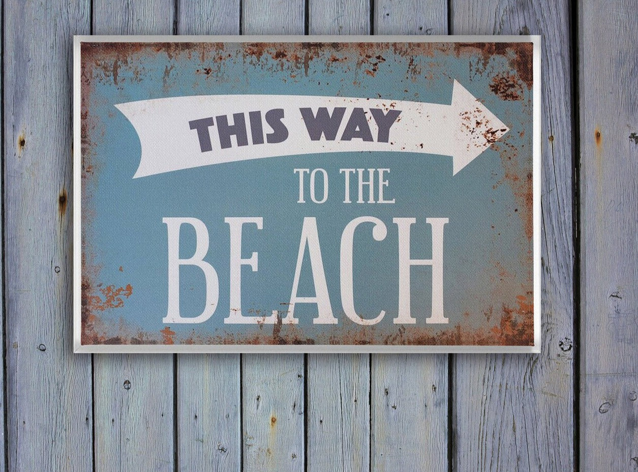 Beach House Decor - This Way To The Beach Print Floating Frame Stretched Canvas hung on wooden wall