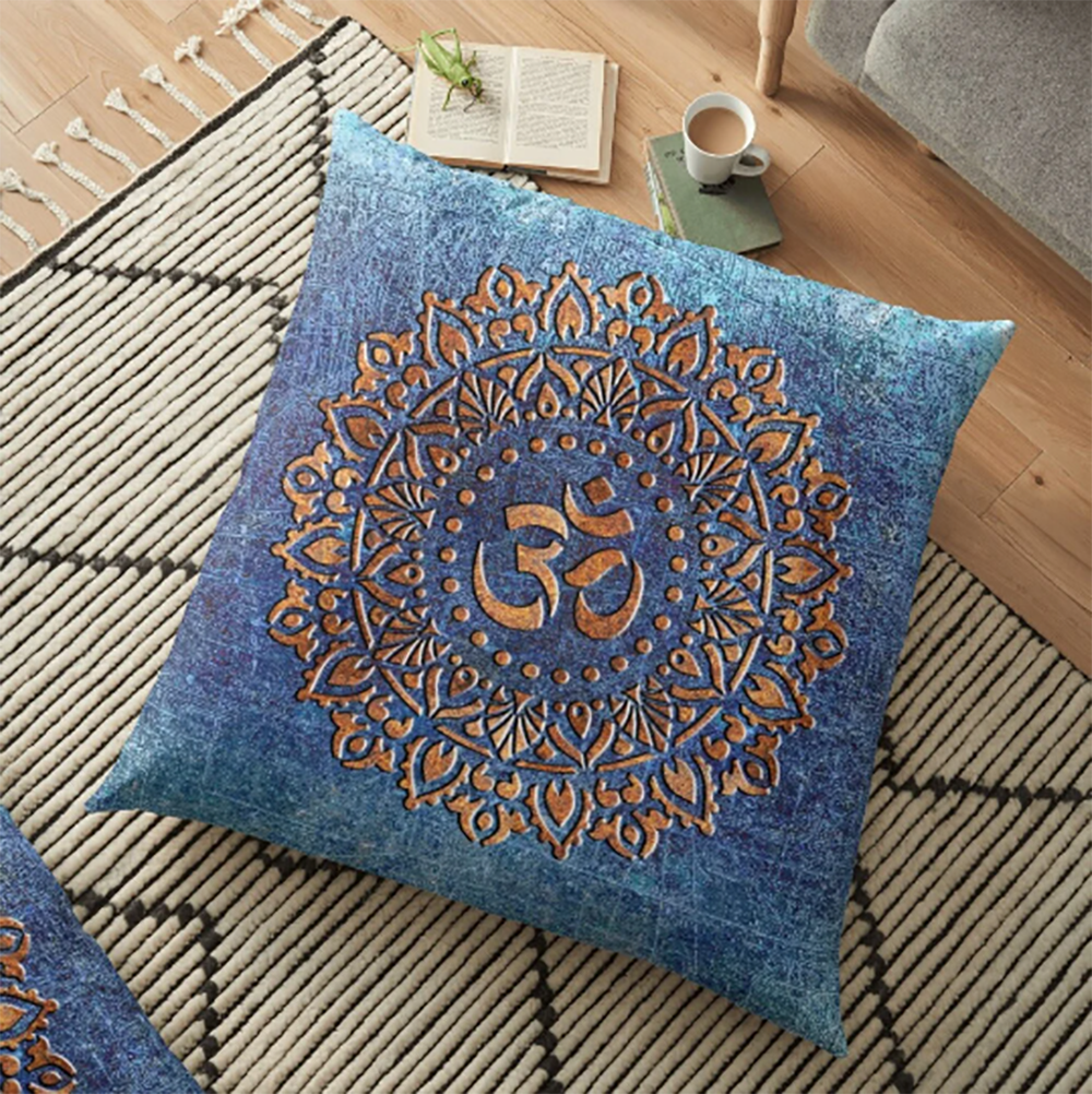 Copper Color Ohm Symbol Mandala Style Print on Distressed Blue Background Square Pillow on rug