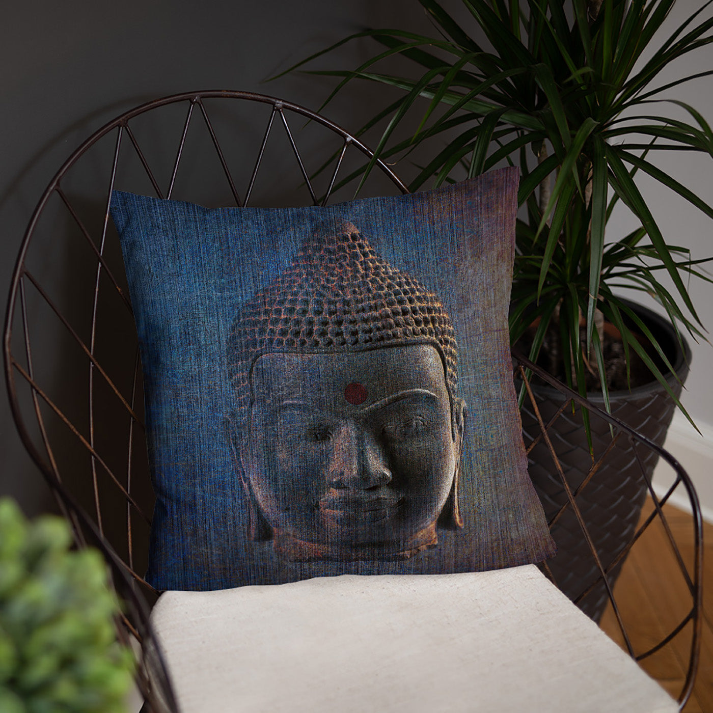 Distressed Blue Buddha Head Print on Outdoor Pillow on chair