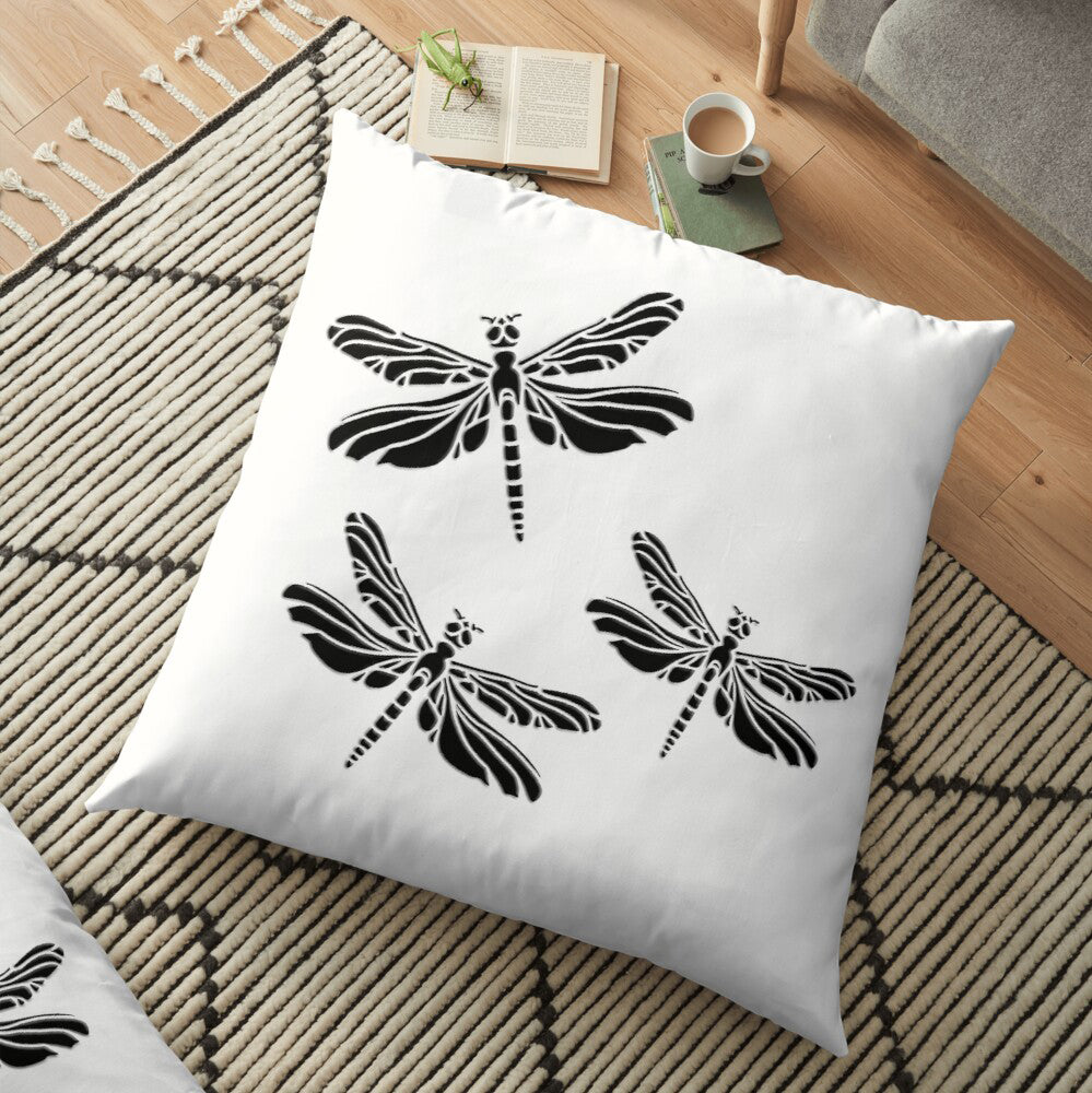 Minimalist square white pillow with 3 black Dragonflies on rug